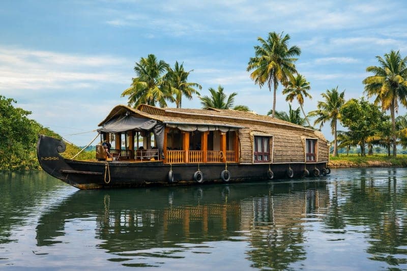 Deluxe houseboat interior in Alleppey Kerala backwaters for family stay