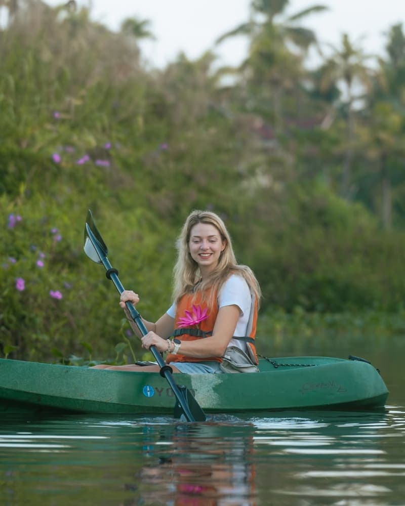 Kayaking experience in Kerala backwaters surrounded by village scenery